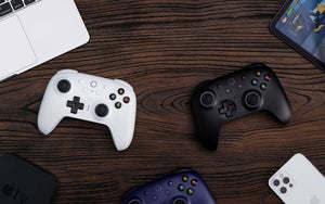 8BitDo Ultimate 2 Wireless Controller in Midnight Blue, White and Black with RGB ring lighting on dark background